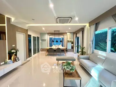 Spacious modern living room with elegant decor and ample natural light