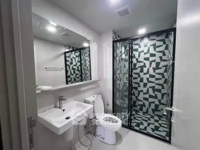 Modern bathroom with geometric shower design and sleek fixtures