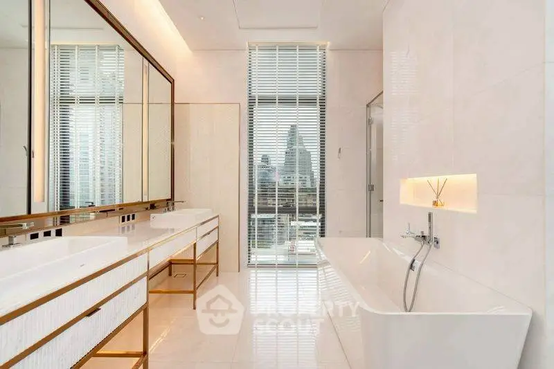 Luxurious bathroom with city view, featuring dual sinks and a sleek bathtub.