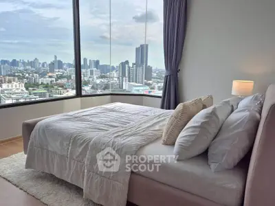 Luxurious bedroom with stunning city view and elegant decor