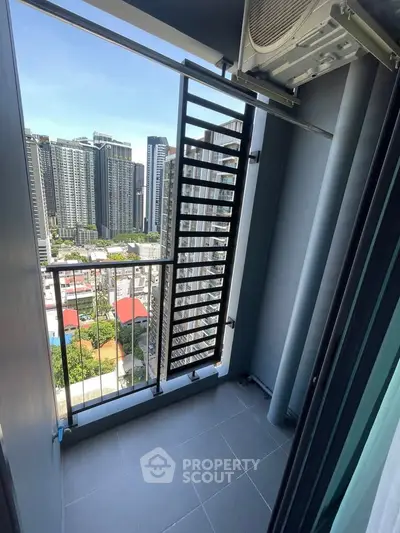 Modern balcony with city skyline view in high-rise apartment