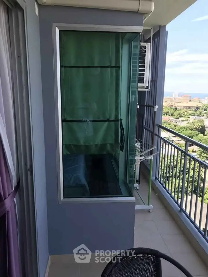 Spacious balcony with scenic view and modern railing, perfect for relaxation and enjoying the outdoors.