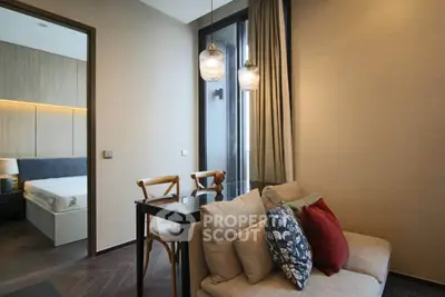 Modern living room with cozy sofa and stylish lighting in a contemporary apartment.