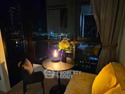Cozy night view from a stylish living room with cityscape backdrop and elegant decor.