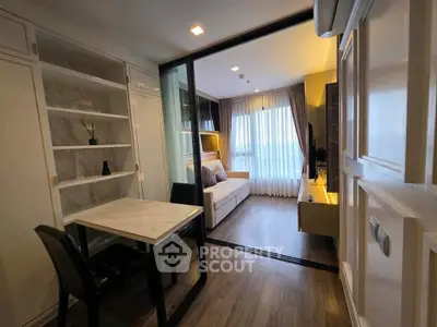 Modern living room with sliding glass doors and elegant decor