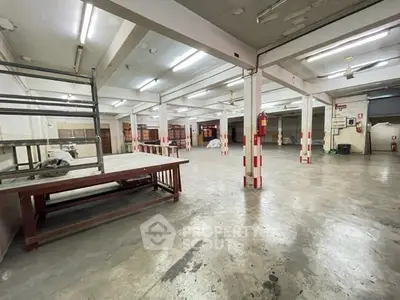 Spacious industrial warehouse with high ceilings and ample storage space