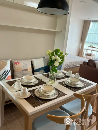 Modern dining area with elegant table setting in stylish apartment