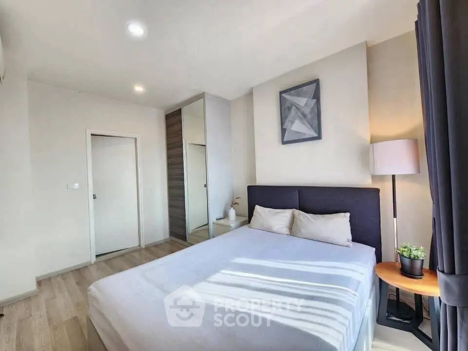 Modern bedroom with stylish decor and ample natural light