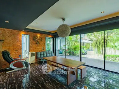 Luxurious modern living room with floor-to-ceiling windows and stylish decor