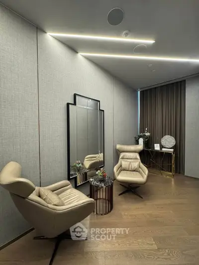 Elegant modern living room with stylish chairs and decor, perfect for relaxation and conversation.
