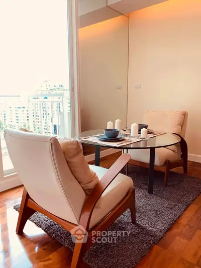 Elegant living room with modern furniture and city view, perfect for urban living.