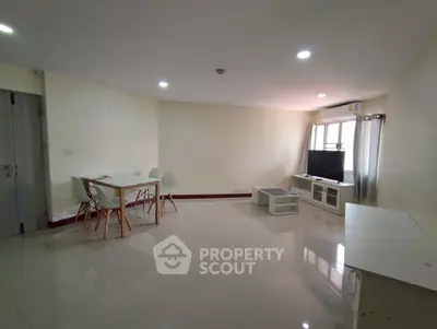 Spacious living room with modern furniture and natural light