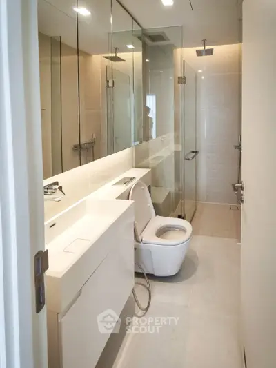 Modern bathroom with sleek glass shower and contemporary fixtures