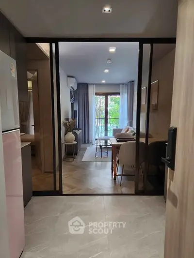 Modern living room with glass sliding doors and stylish decor