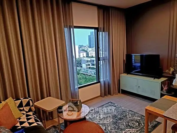 Stylish living room with modern decor and city view, perfect for urban living.