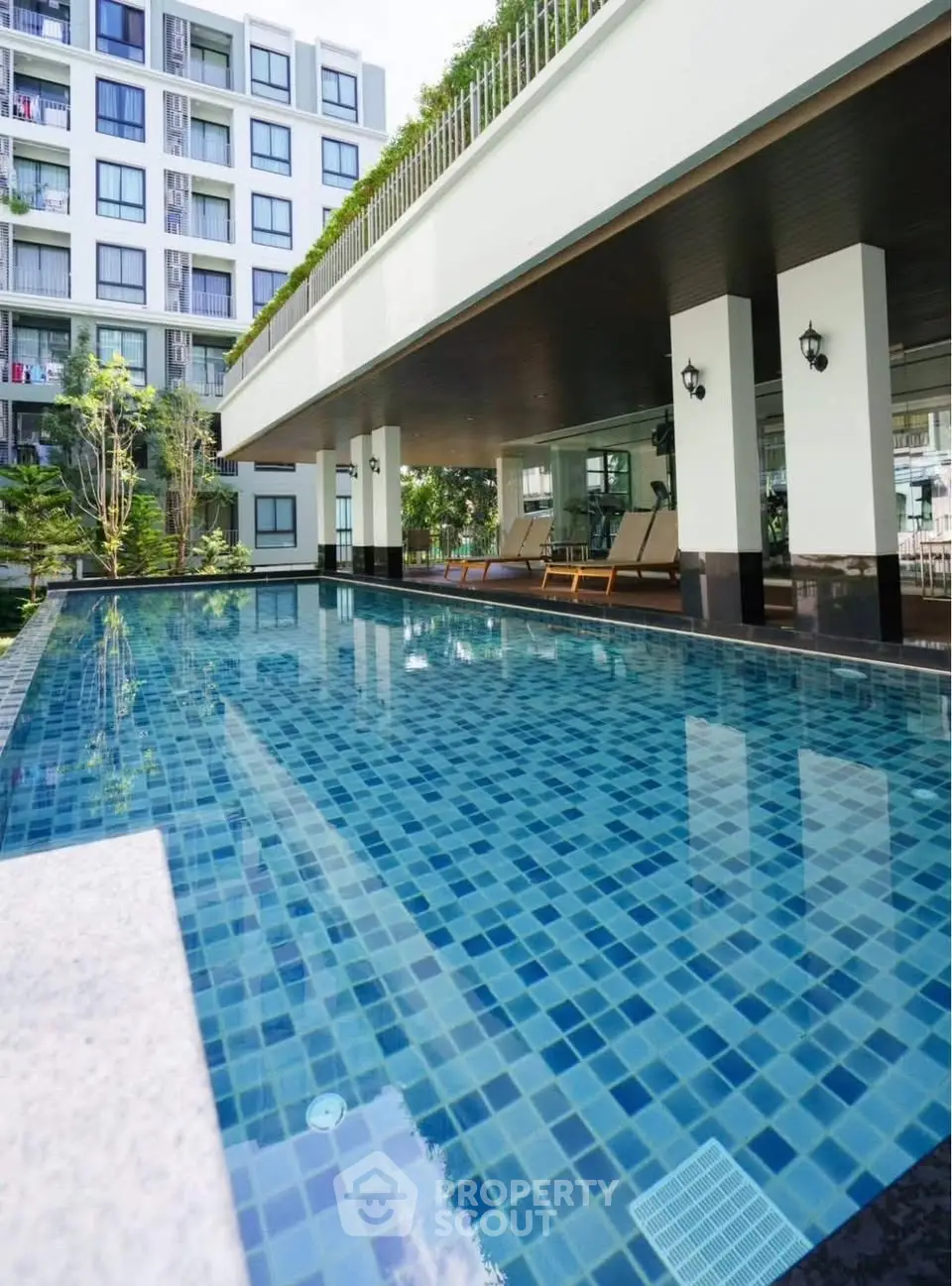 Luxurious condominium with stunning pool and modern architecture