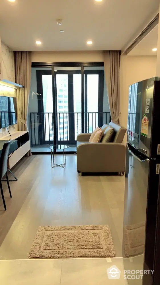 Modern living room with balcony view in high-rise apartment