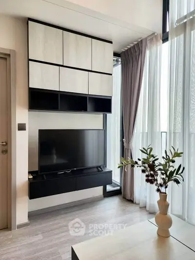 Modern living room with sleek TV setup and elegant decor