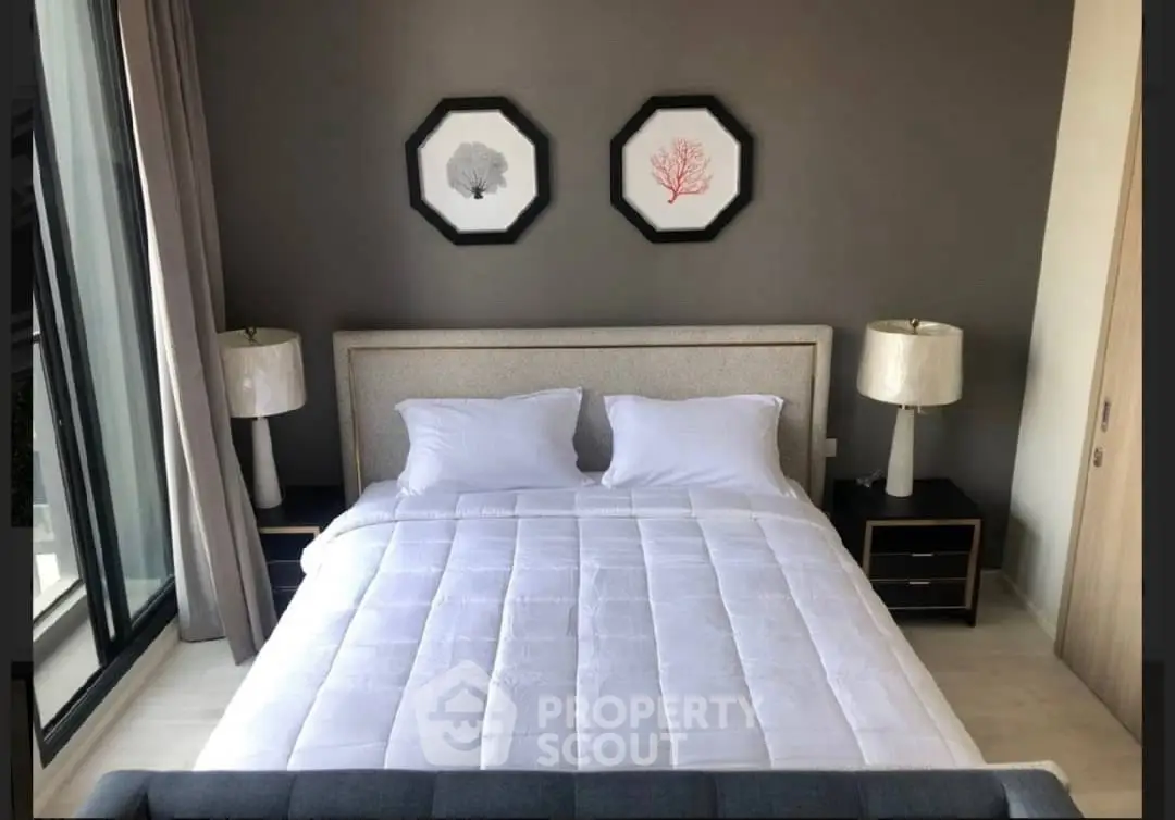 Modern bedroom with stylish decor and natural light