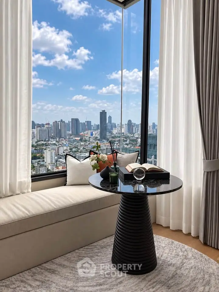 Luxurious high-rise apartment with stunning city view from the living room window.