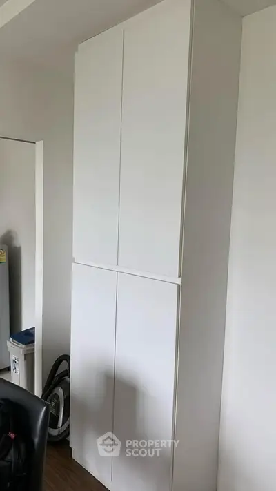 Modern white storage cabinet in a minimalist interior space