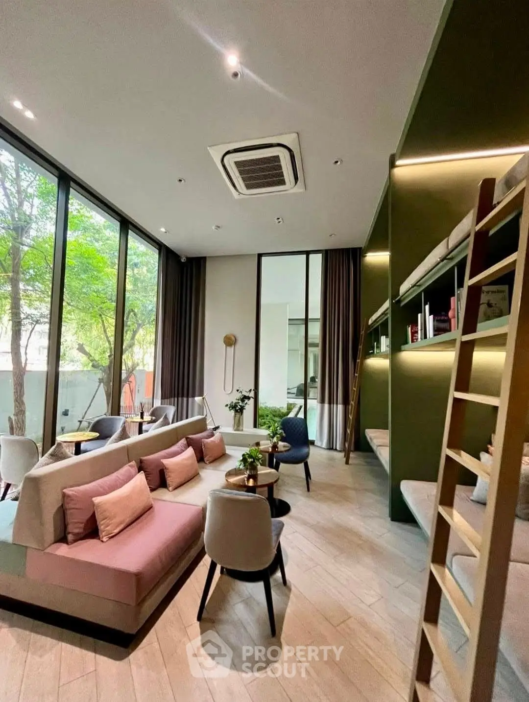 Modern living room with high ceilings, large windows, and stylish furniture in a contemporary home.