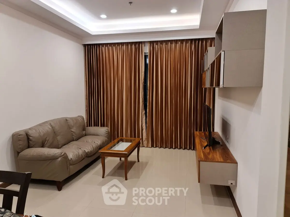 Modern living room with elegant brown curtains and cozy leather sofa