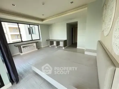 Spacious modern living room with large windows and elegant design