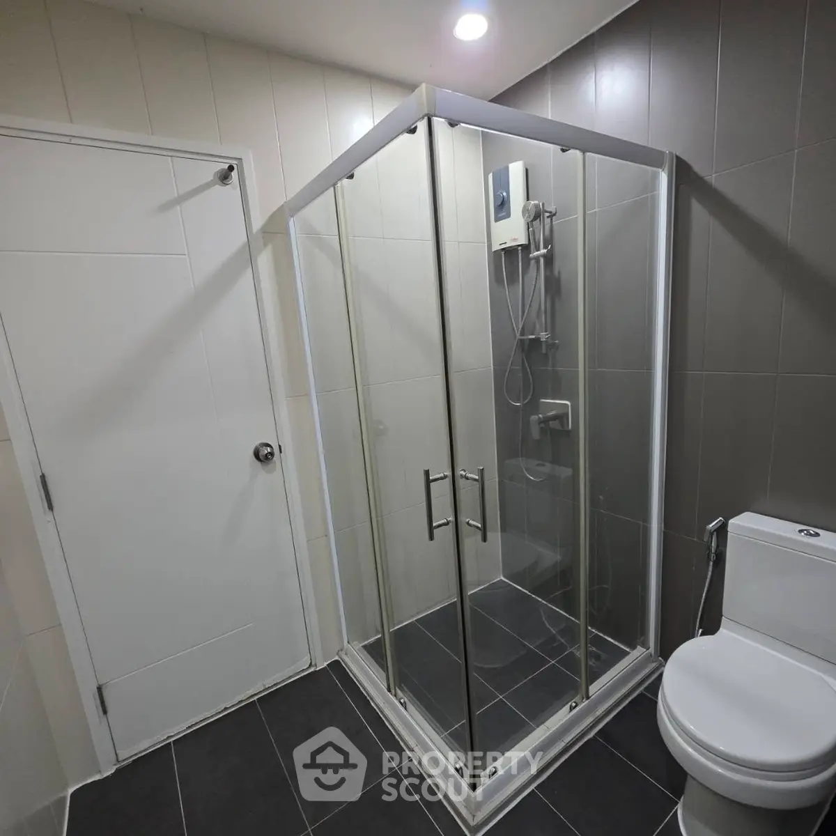 Modern bathroom with glass shower enclosure and sleek design