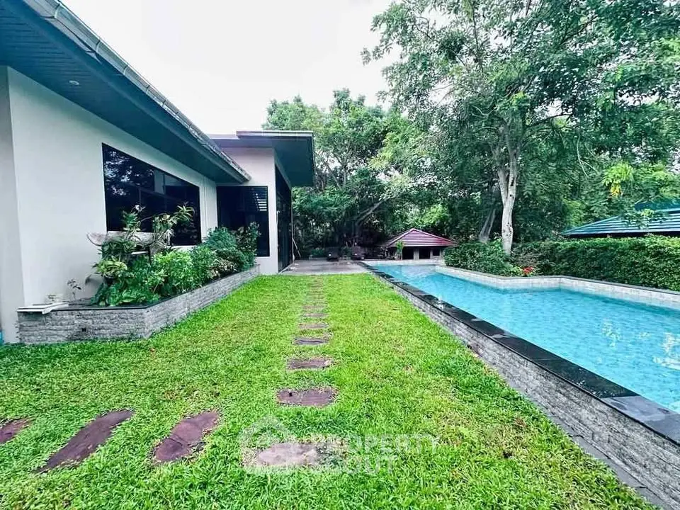 Luxurious property with lush garden and inviting swimming pool, perfect for relaxation and outdoor enjoyment.