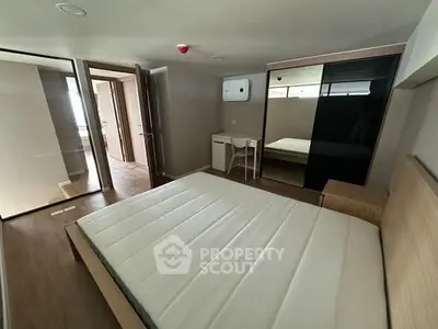 Modern bedroom with minimalist design and ample natural light