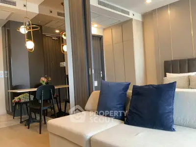 Modern living room with stylish decor and cozy seating in a contemporary apartment.