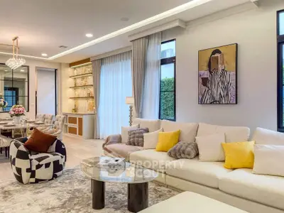 Luxurious living room with modern decor, plush seating, and elegant lighting, perfect for relaxation and entertainment.