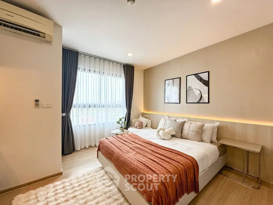 Modern bedroom with stylish decor and natural light