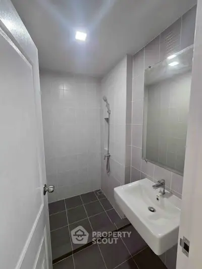 Modern bathroom with sleek tiles and contemporary fixtures