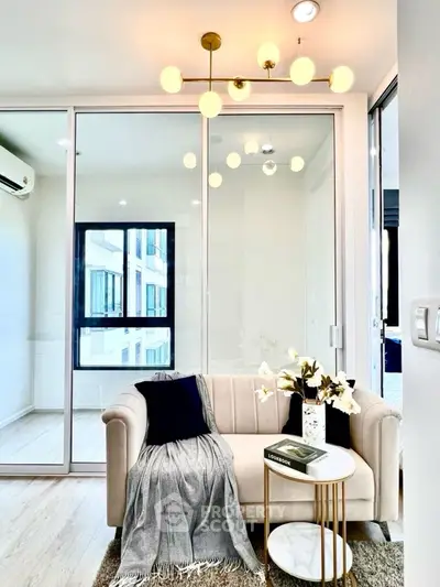 Modern living room with elegant lighting and cozy seating area