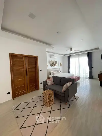 Spacious modern living room with stylish decor and natural light