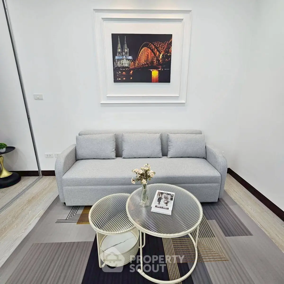 Modern living room with stylish sofa and artistic wall decor