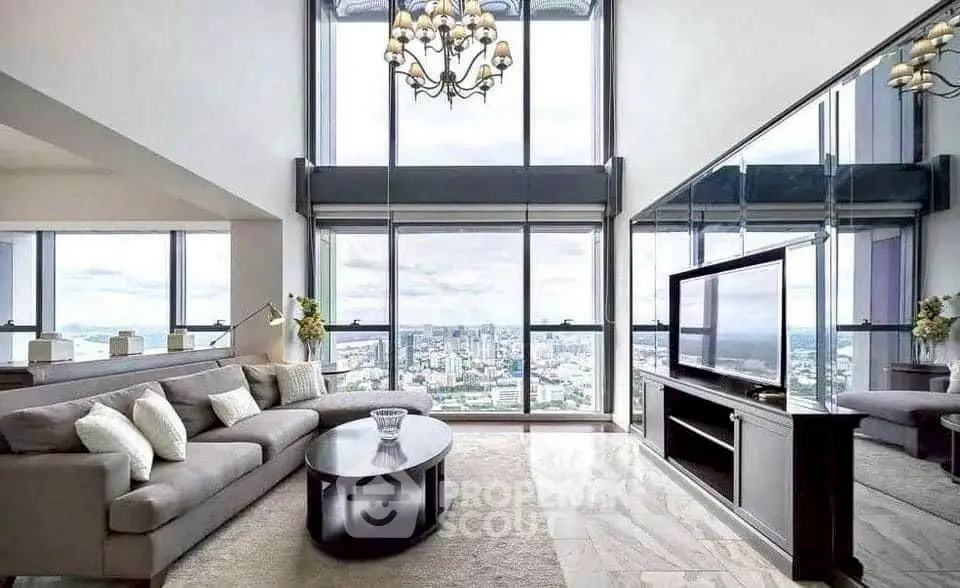 Luxurious high-rise living room with panoramic city views and elegant decor.
