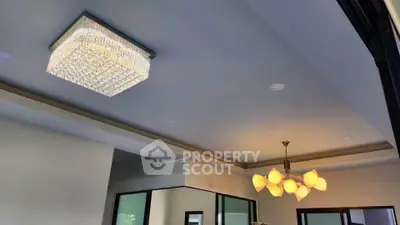 Elegant modern ceiling with stylish lighting fixtures in a contemporary living space.