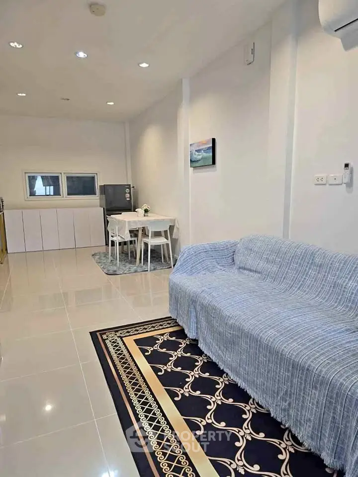 Spacious living room with modern decor and dining area