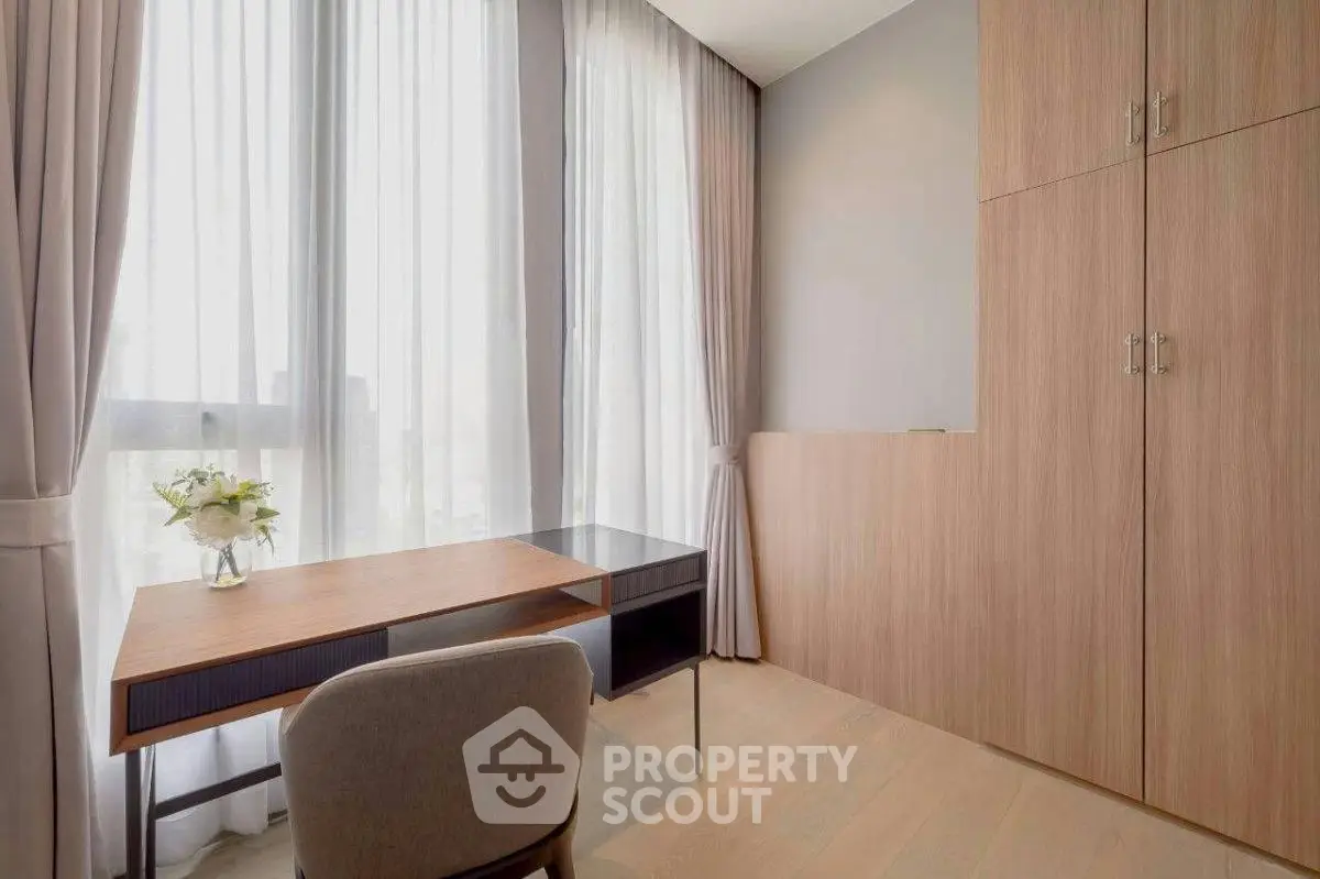Modern study room with elegant desk and large windows