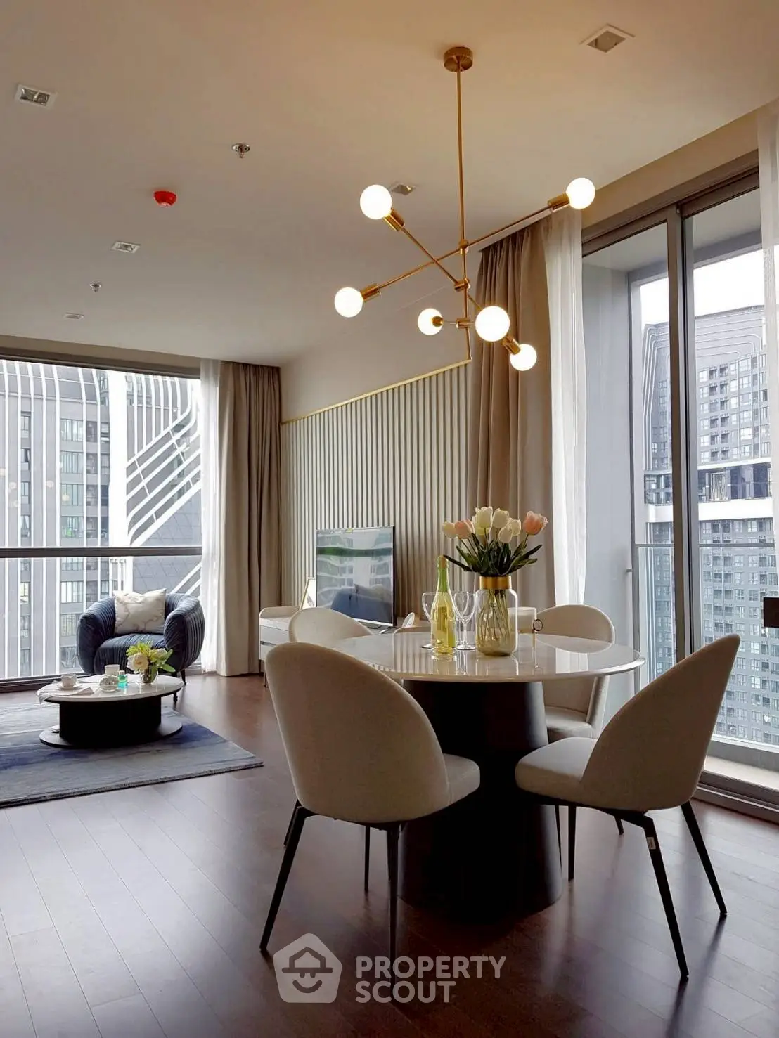 Modern living room with elegant dining area and city view