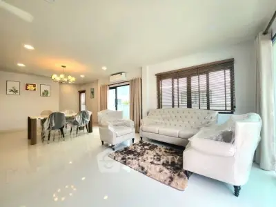 Spacious modern living room with elegant dining area and natural light