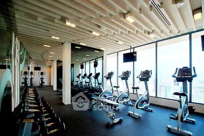 Modern gym with city view in luxury residential building