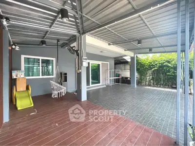 Spacious covered patio with modern design and garden view