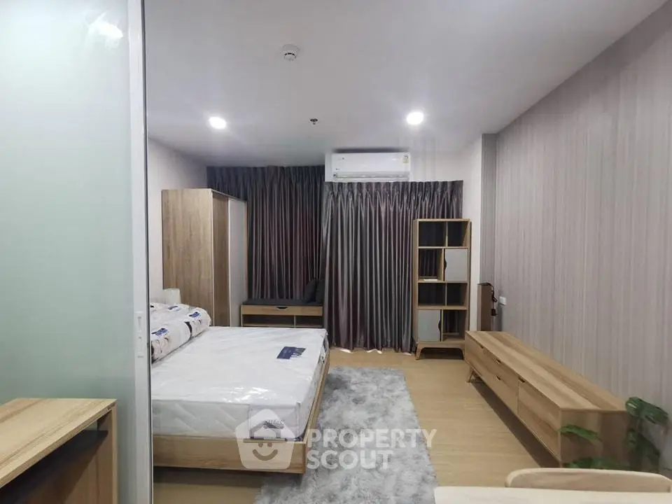 Modern bedroom with stylish furniture and cozy ambiance in a contemporary apartment.