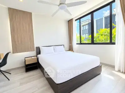 Bright and modern bedroom with large windows and stylish decor