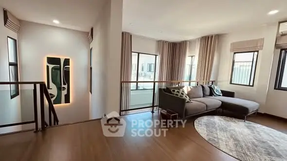 Spacious modern living room with large windows and stylish decor