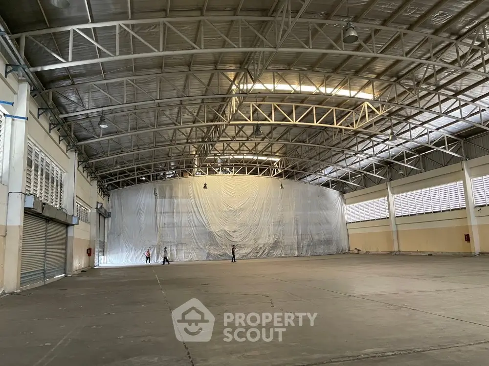 Spacious industrial warehouse with high ceilings and ample floor space for versatile use.